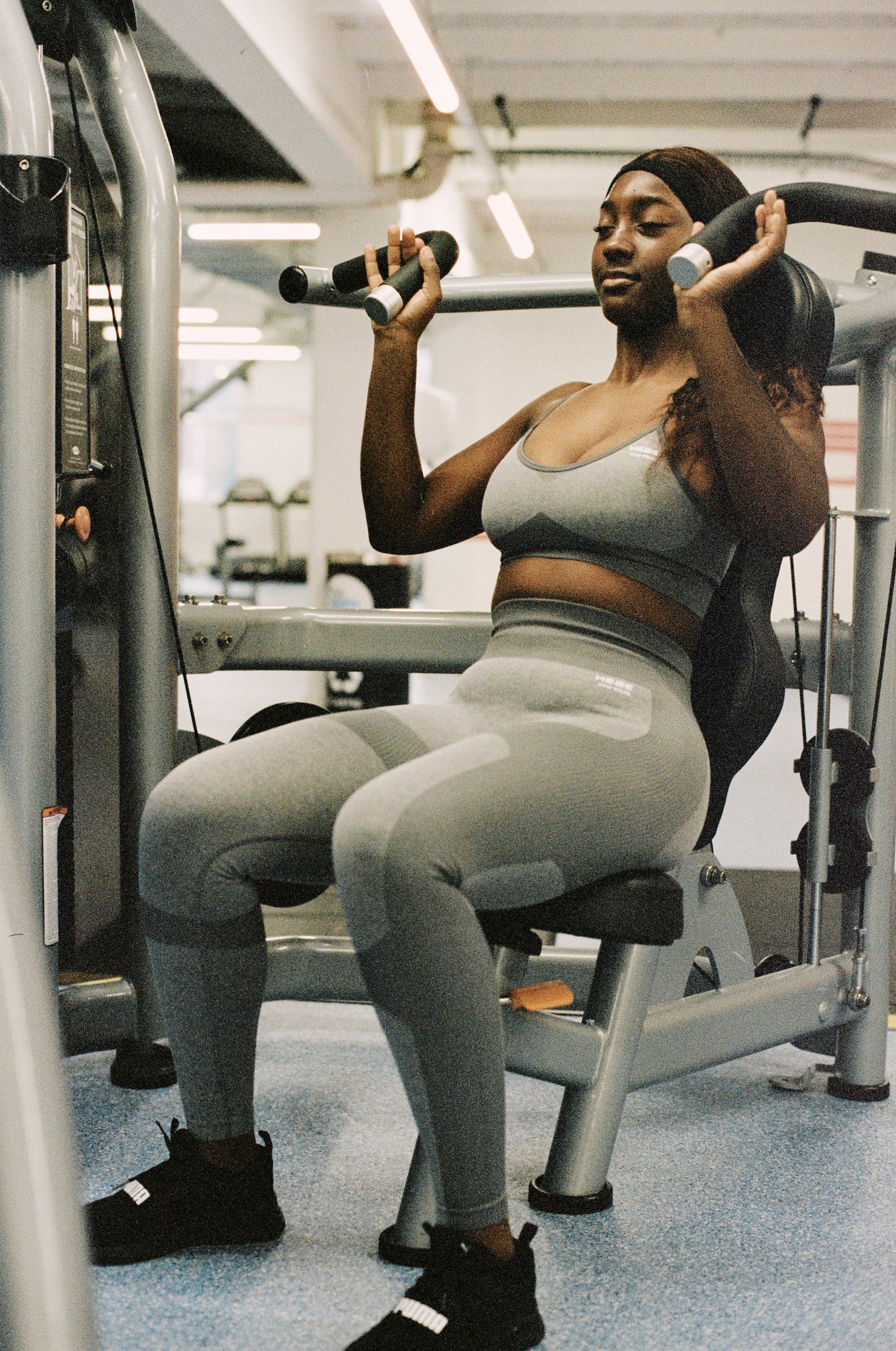 girl in grey gym wear working out