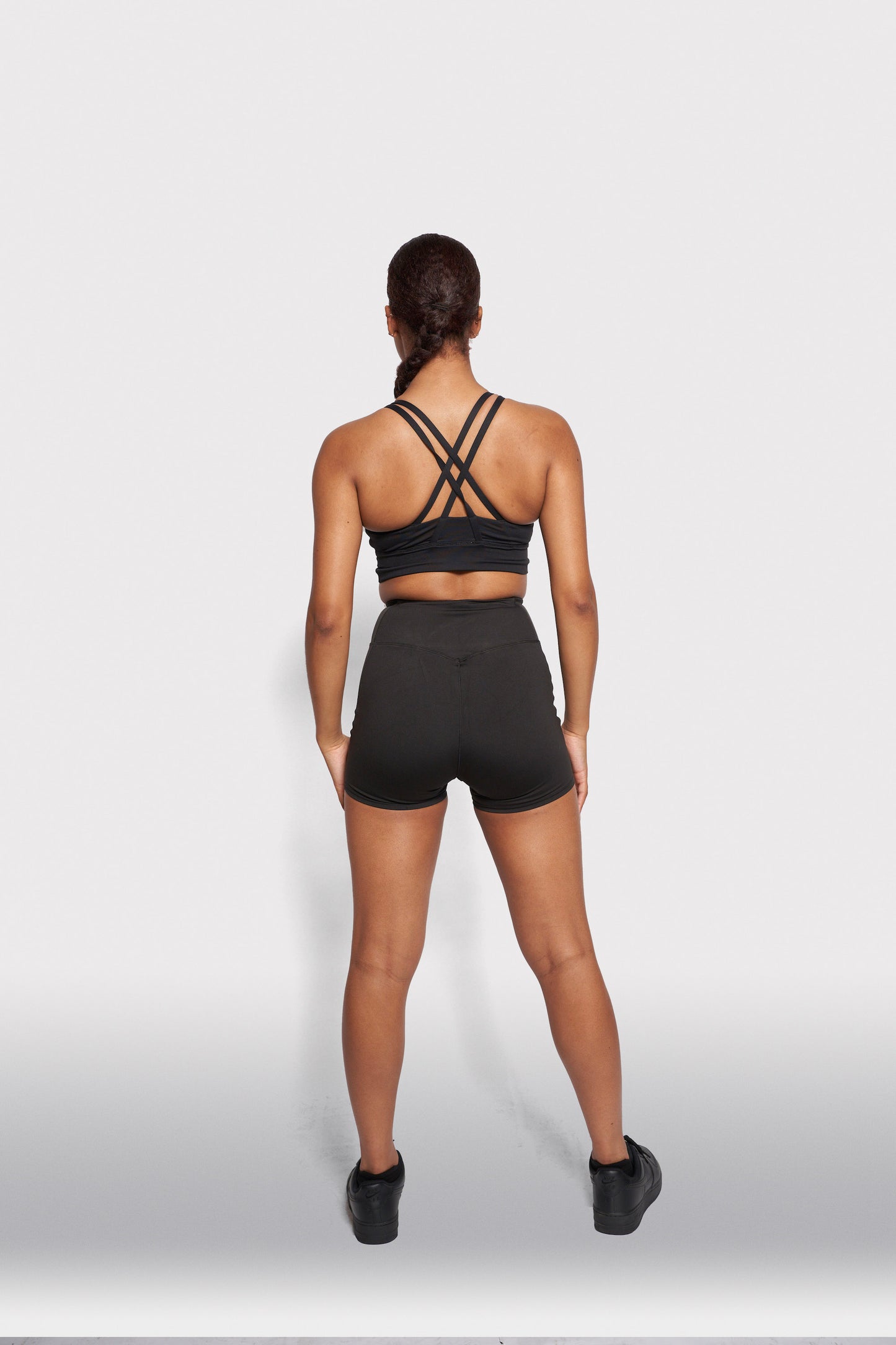 girl in black hebe smooth shorts and bra top