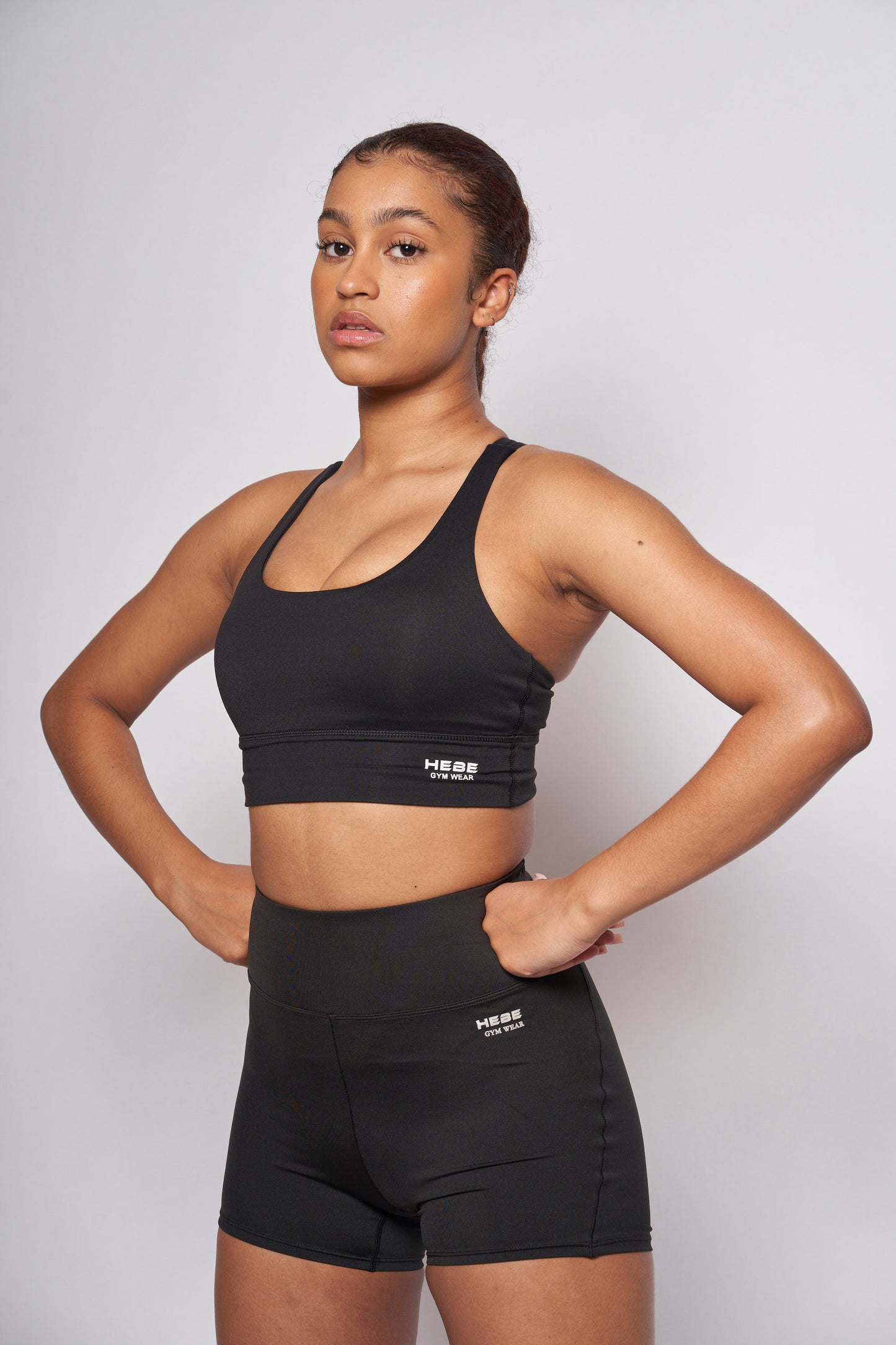 girl in black hebe smooth shorts and bra top
