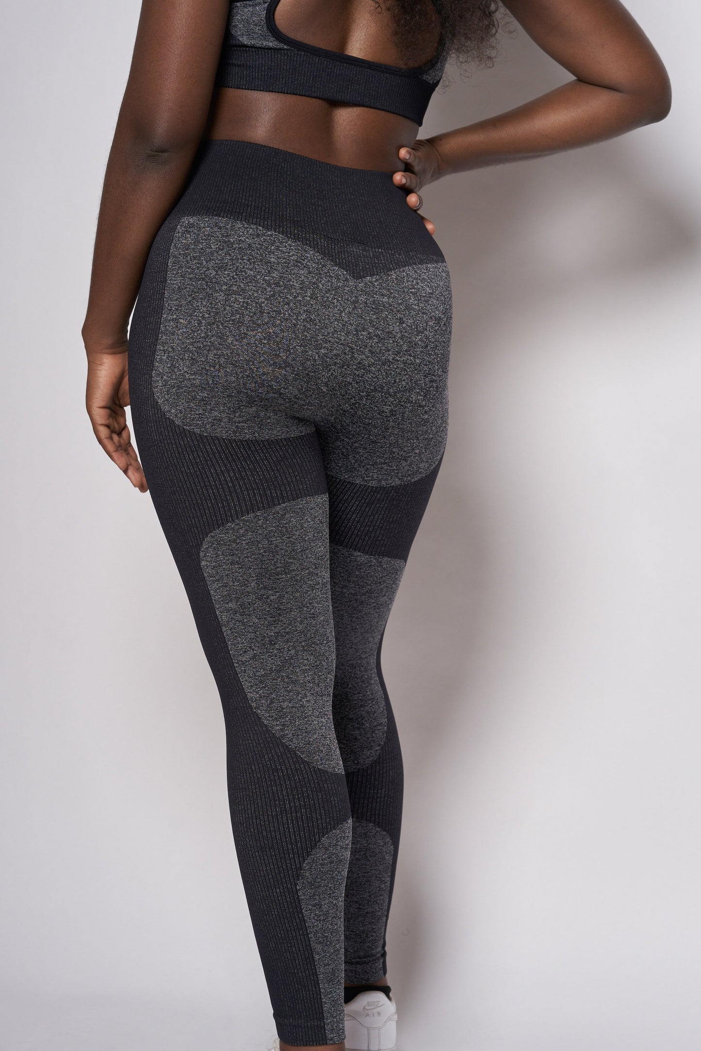 model wearing grey gym leggings