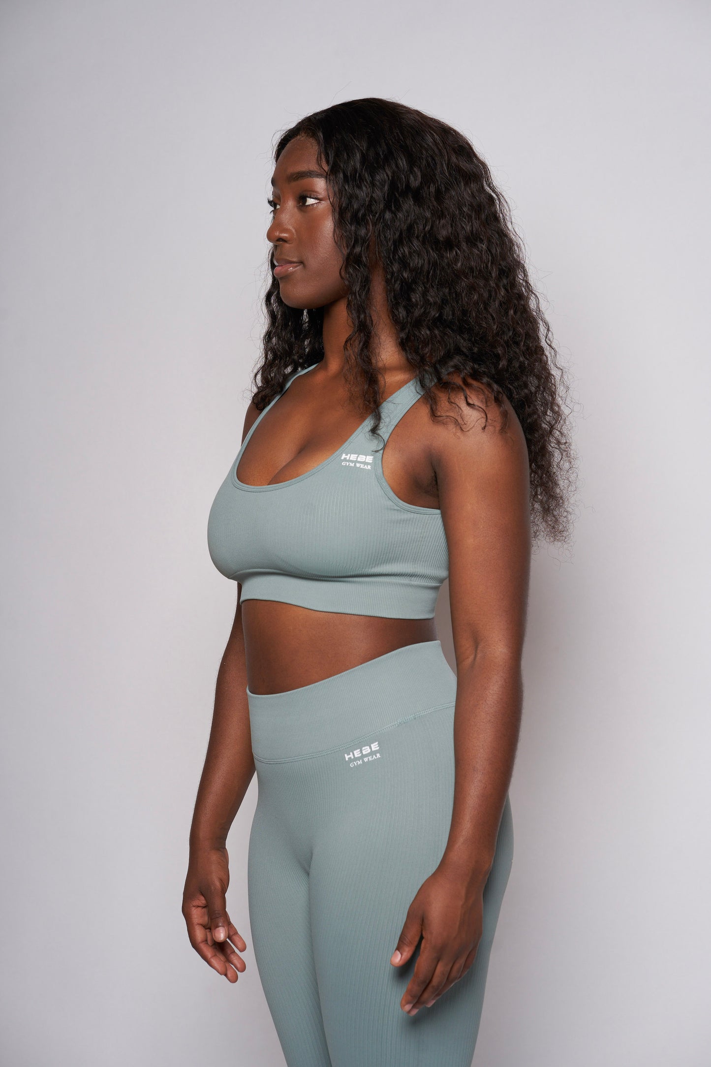 girl in hebe mint green gymwear leggings and bra top