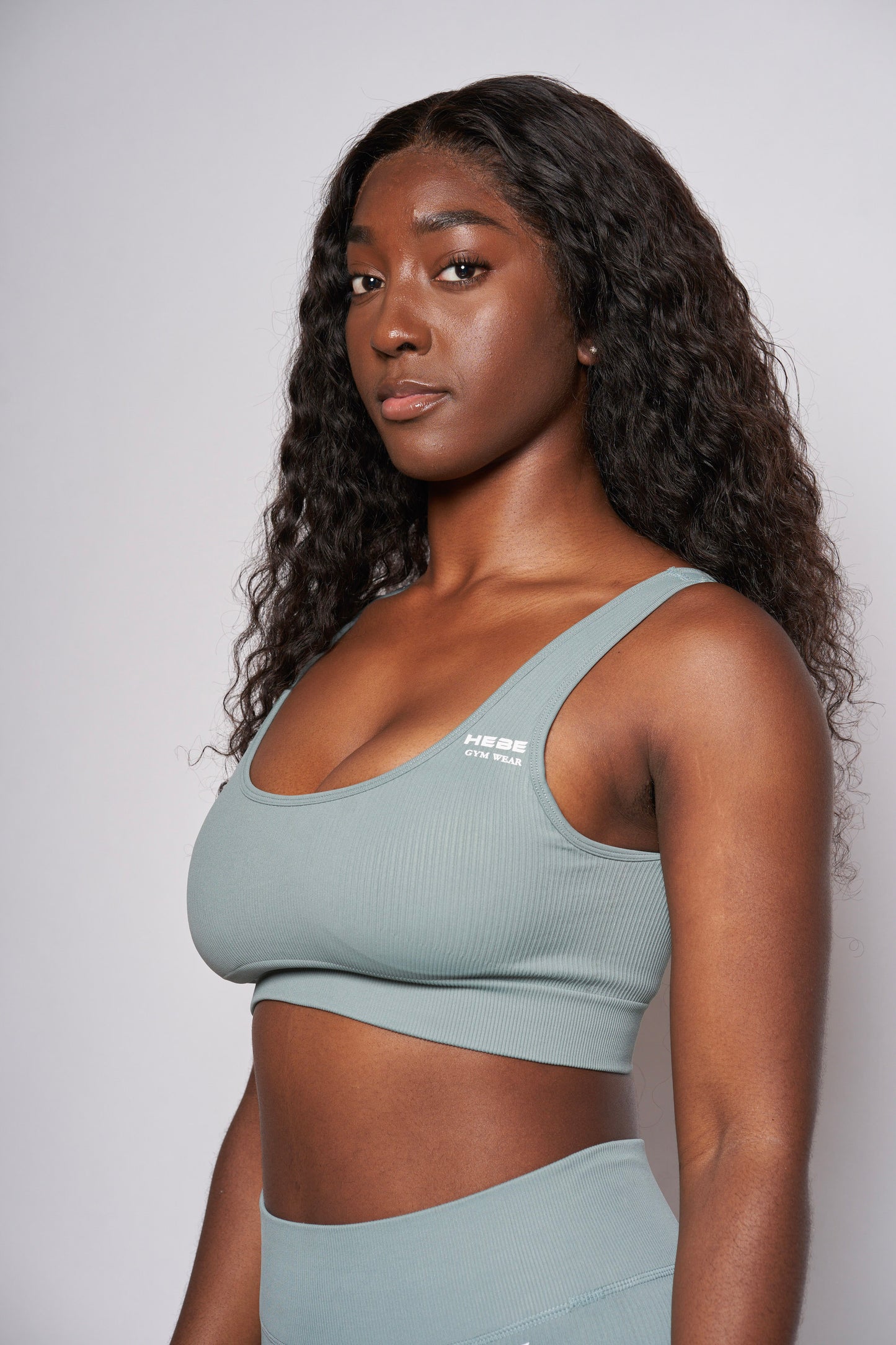 girl in hebe mint green gymwear leggings and bra top