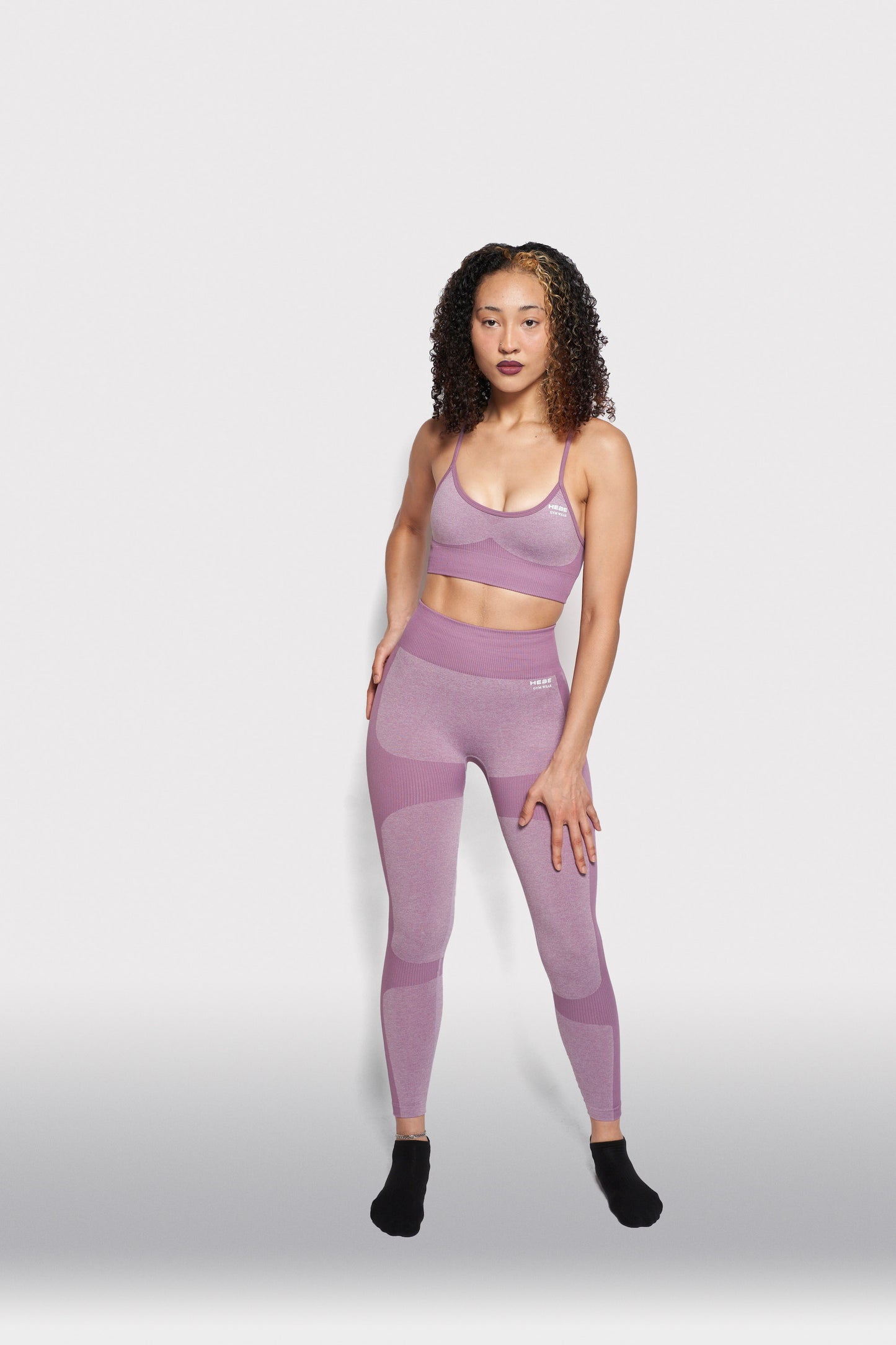girl wearing purple gym clothes