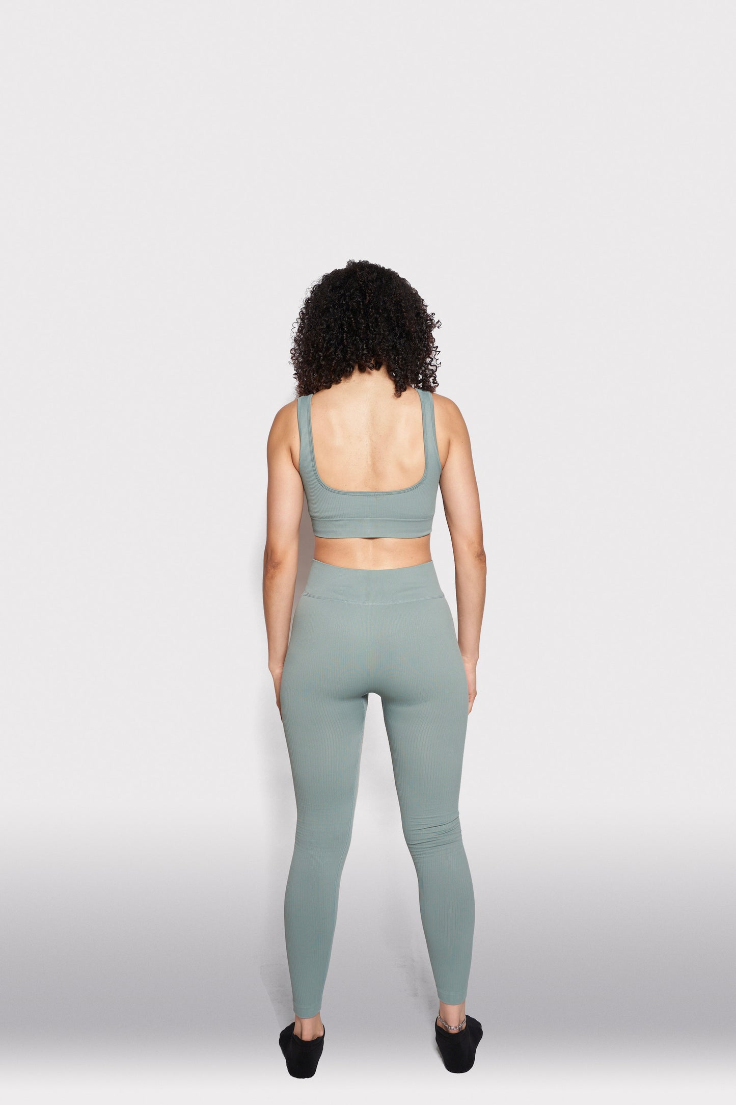 girl in hebe mint green gymwear leggings and bra top