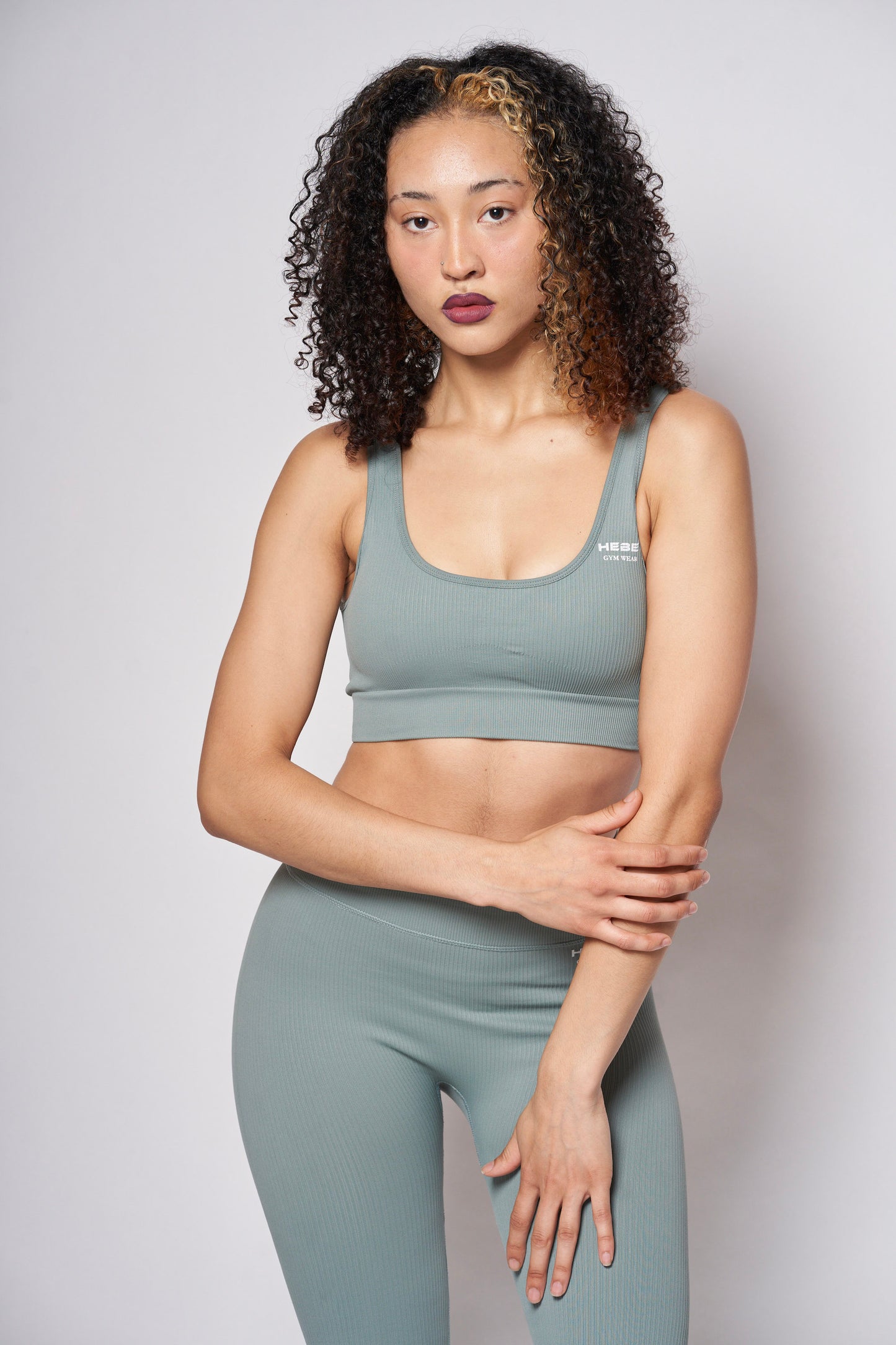 girl in hebe mint green gymwear leggings and bra top